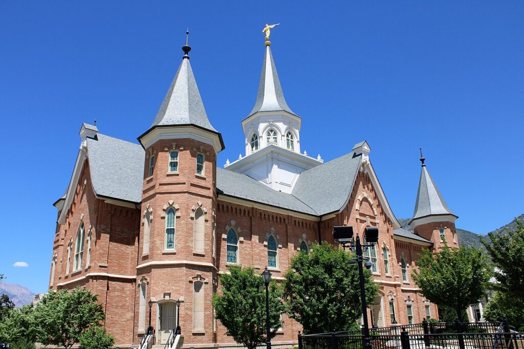 Provo City Center Temple red brick and slate roof under blue sky, Provo Utah