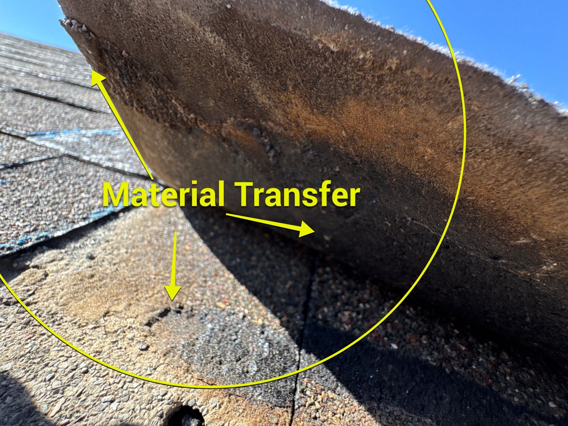 Material transfer marks on a wind-damaged shingle — annotated Rooval inspection photo, Utah County