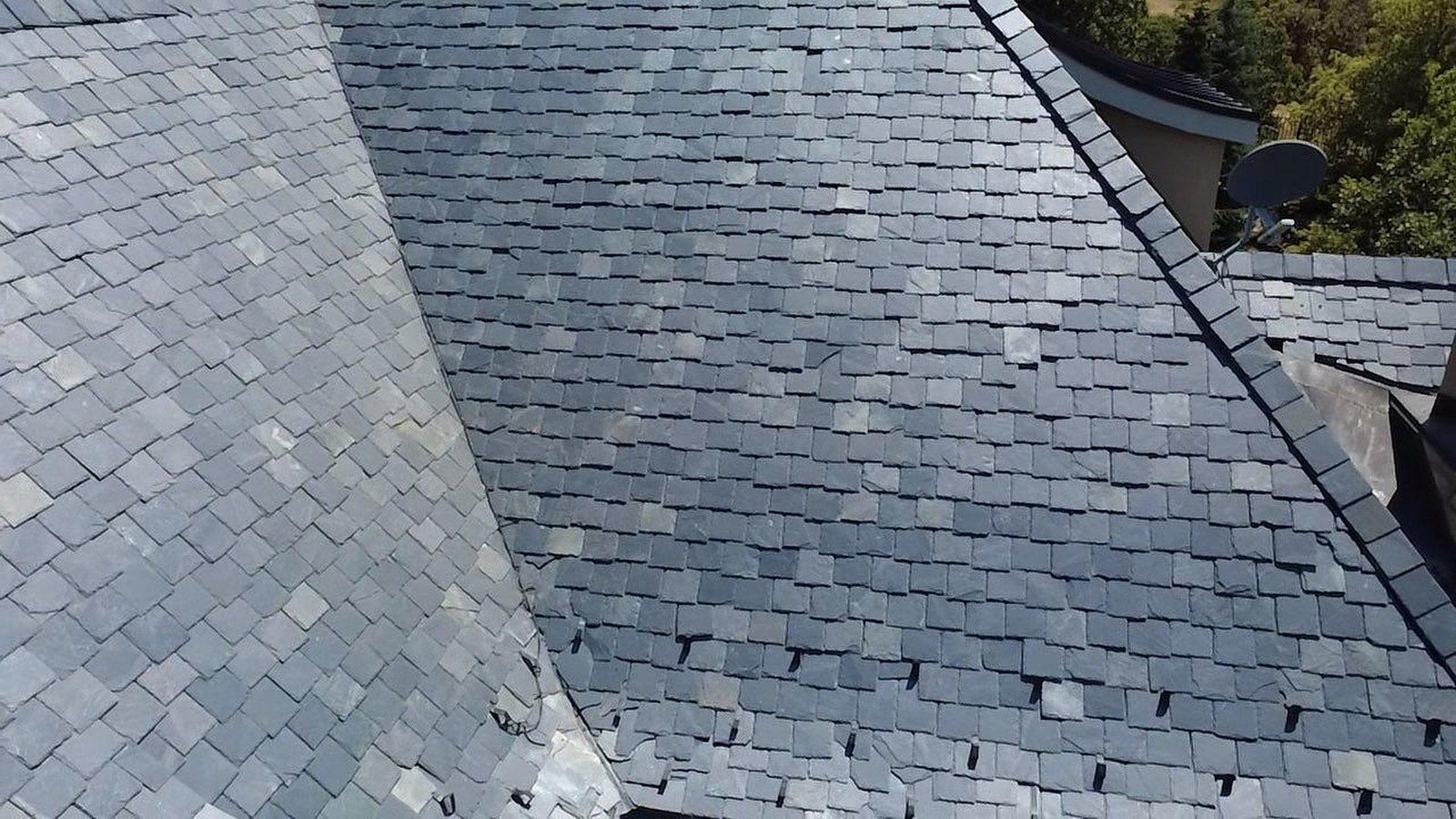 Natural slate roof with gray and green slates on a custom home in Mapleton, Utah.
