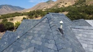 Natural slate roof on a Mapleton, Utah home with the Wasatch foothills in the background.
