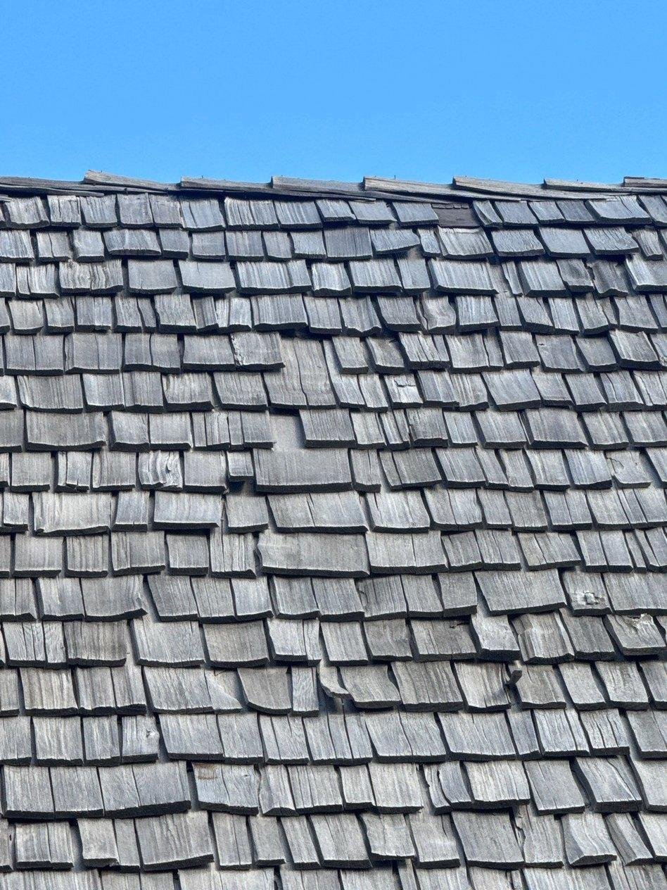Weathered gray cedar shake roof seen from the ridge on a home in Eureka, Utah.